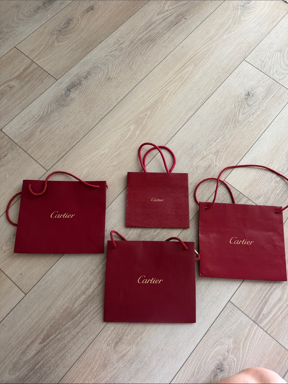 4 authentic Cartier shopping bags